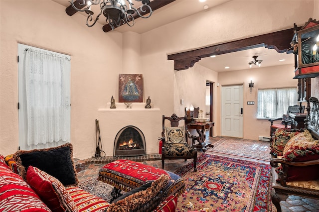 living room featuring a chandelier and baseboard heating