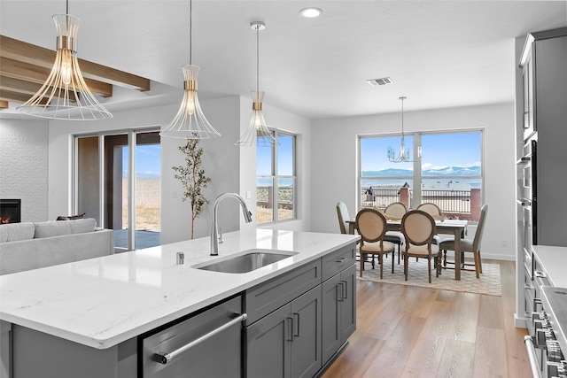 20 Confianza, Los Alamos, NM 87547 - kitchen featuring gray cabinets, stainless steel dishwasher, a chandelier, and recessed lighting