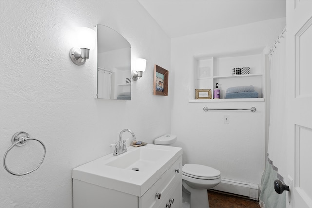 bathroom featuring vanity, a baseboard radiator, walk in shower, and toilet