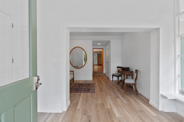 foyer entrance with light hardwood / wood-style floors