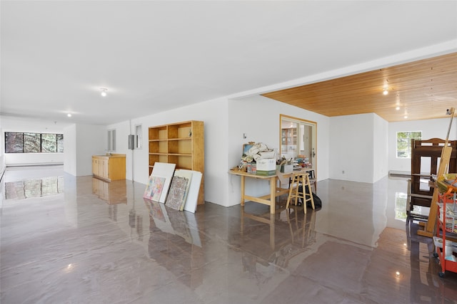 dining room with wooden ceiling and a healthy amount of sunlight