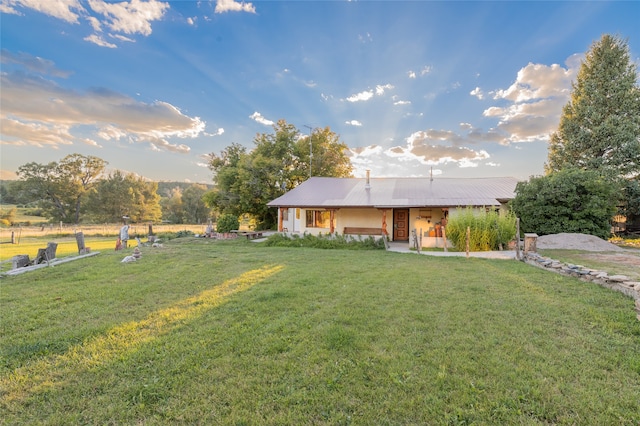 view of front of home with a front yard