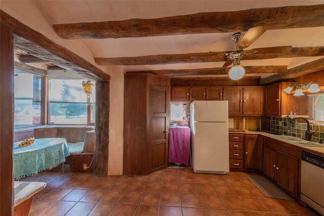 kitchen with ceiling fan, beam ceiling, sink, white appliances, and tasteful backsplash