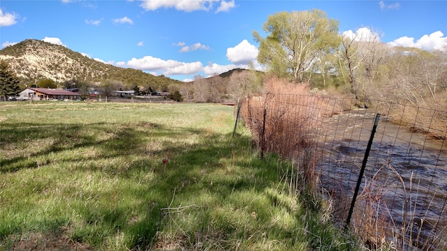 view of mountain feature with a rural view