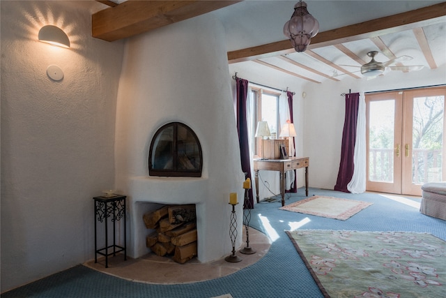 foyer with light carpet, beam ceiling, ceiling fan, and french doors