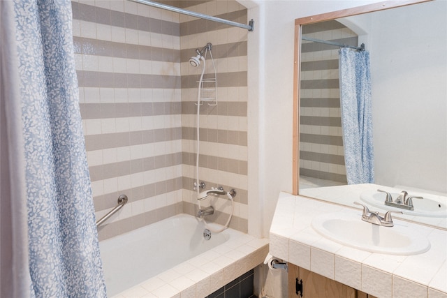 bathroom with shower / tub combo and sink