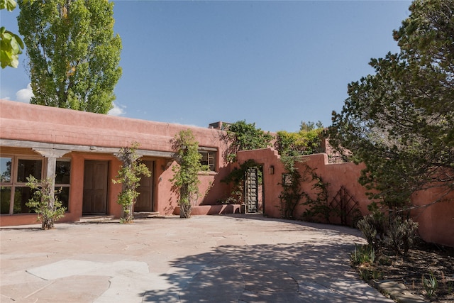 view of pueblo revival-style home