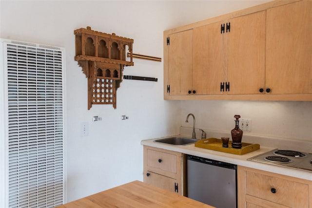 kitchen featuring stainless steel appliances, light brown cabinets, and sink