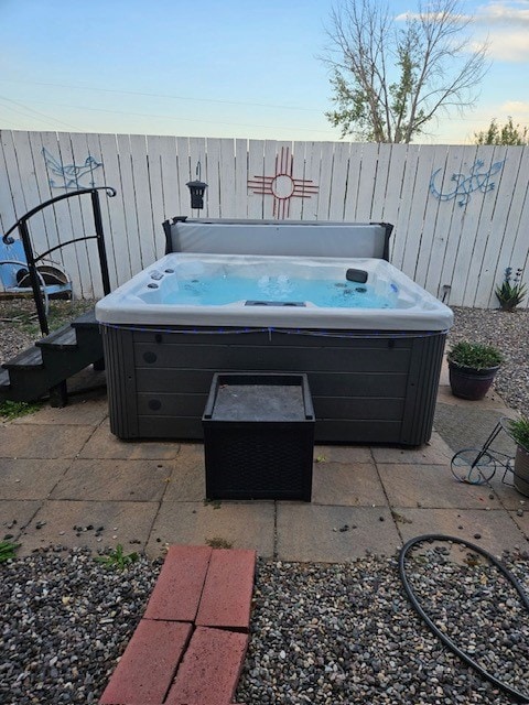 view of patio / terrace featuring a hot tub