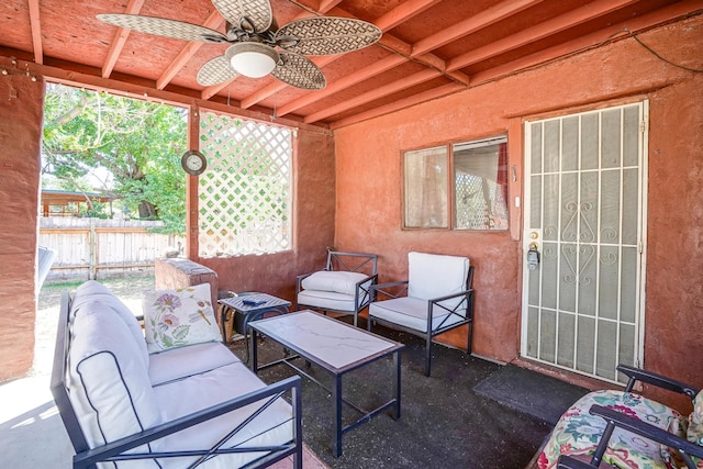 view of patio with outdoor lounge area and ceiling fan