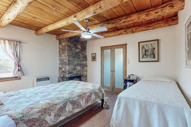 bedroom with a fireplace, wood ceiling, beam ceiling, and ceiling fan