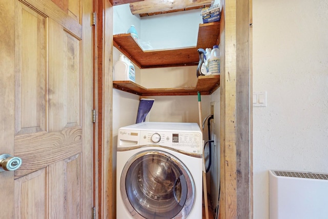 laundry room with washer / dryer