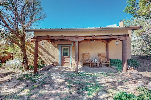 back of house featuring a patio