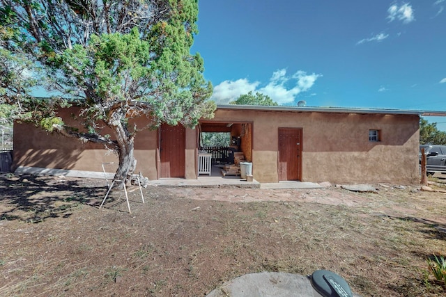 rear view of house featuring a patio area