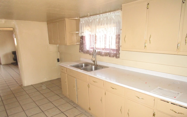 kitchen with sink and light tile patterned floors