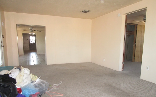 unfurnished room featuring carpet