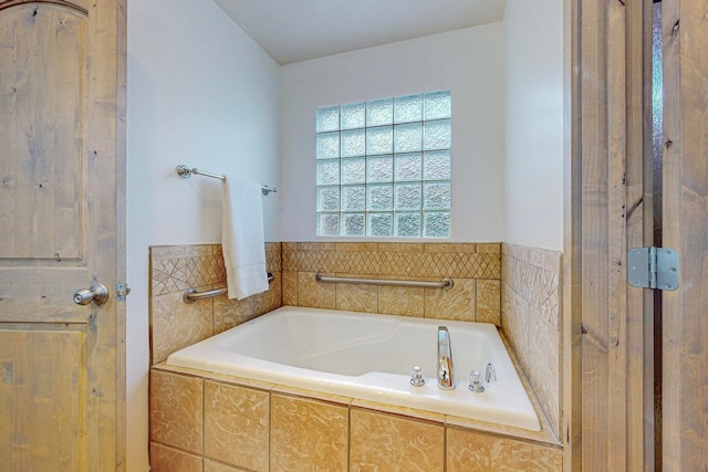 bathroom featuring a relaxing tiled tub