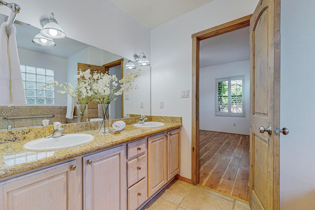 bathroom featuring hardwood / wood-style flooring and vanity