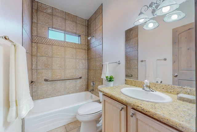 full bathroom with tile patterned flooring, tiled shower / bath combo, vanity, and toilet