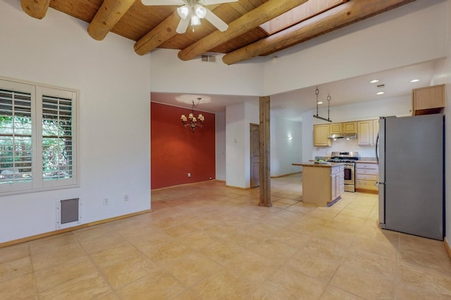 kitchen with beamed ceiling, light brown cabinets, wood ceiling, appliances with stainless steel finishes, and a center island