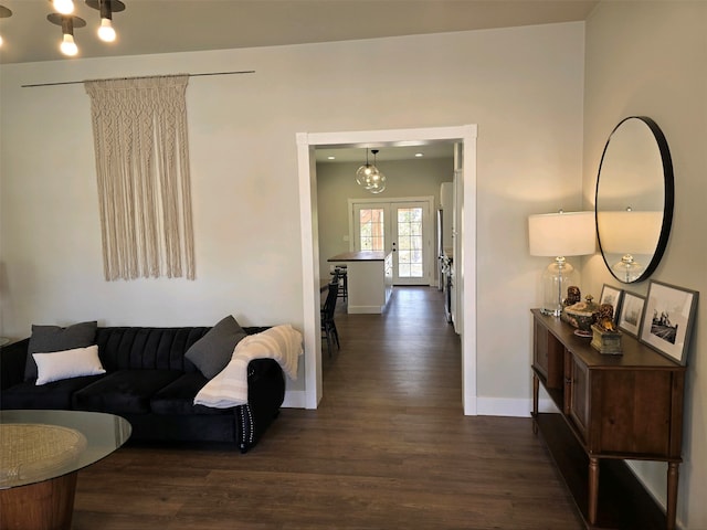 living room featuring french doors and dark hardwood / wood-style floors