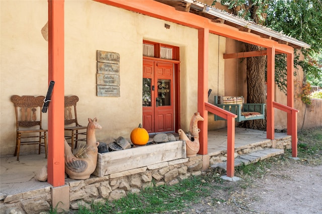 entrance to property featuring french doors