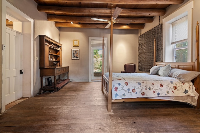 bedroom with ceiling fan, hardwood / wood-style flooring, beam ceiling, and multiple windows