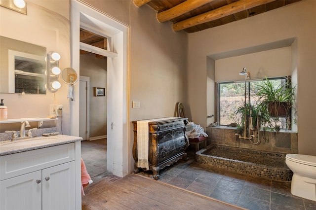 bathroom with toilet, wood-type flooring, wooden ceiling, beam ceiling, and vanity