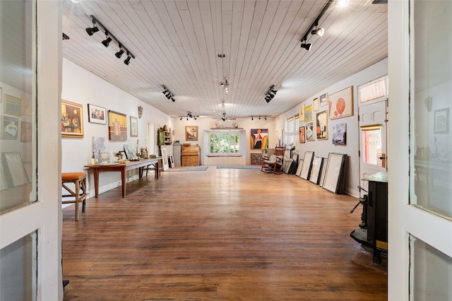 miscellaneous room featuring rail lighting, wooden ceiling, and wood-type flooring