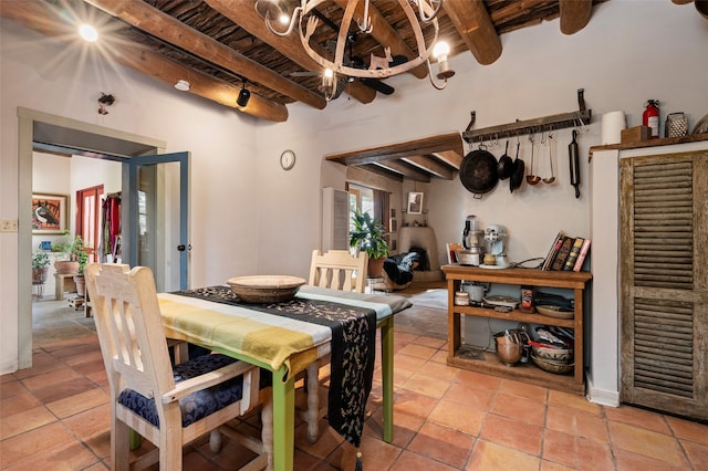 dining room featuring wooden ceiling, beam ceiling, and a notable chandelier