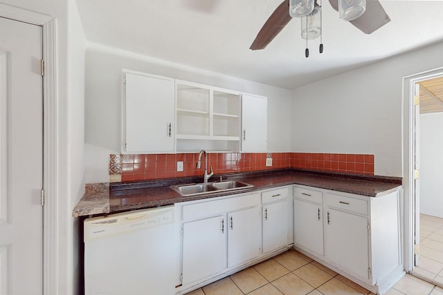 kitchen featuring white cabinets, white dishwasher, and decorative backsplash