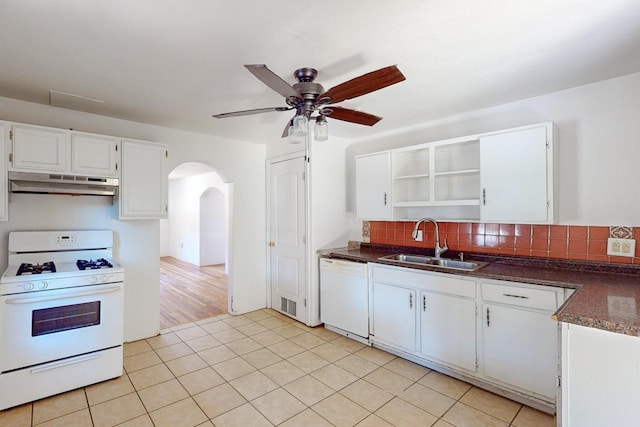 kitchen with ceiling fan, white cabinets, sink, white appliances, and tasteful backsplash