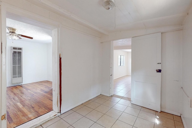 unfurnished room with light wood-type flooring and ceiling fan