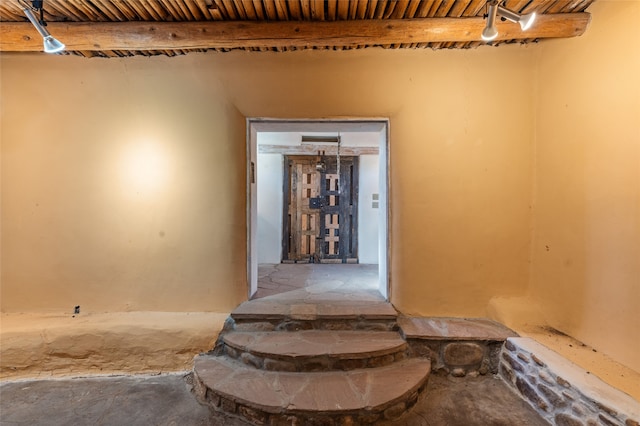 interior space with beam ceiling and wood ceiling