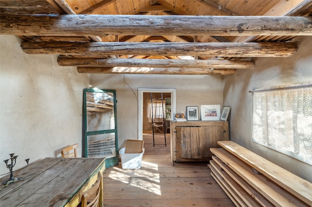 misc room with beamed ceiling, wood-type flooring, and wooden ceiling