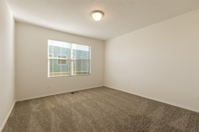 empty room featuring carpet floors