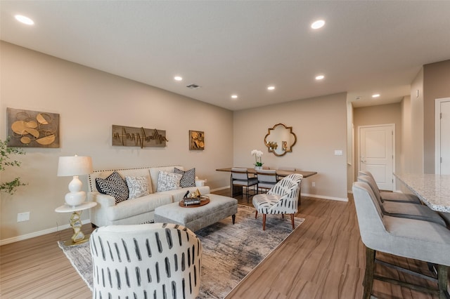 living room with light hardwood / wood-style floors