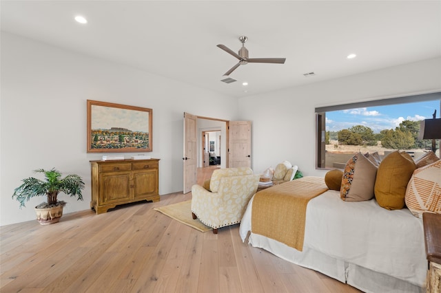 bedroom featuring ceiling fan and light hardwood / wood-style floors