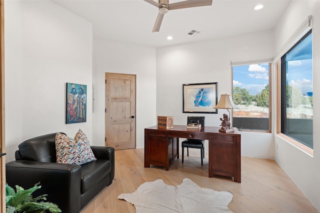 office area featuring light hardwood / wood-style flooring and ceiling fan