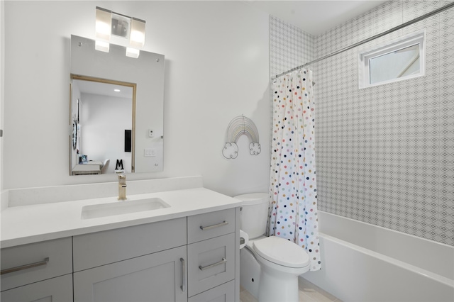 full bathroom featuring vanity, shower / bath combination with curtain, and toilet