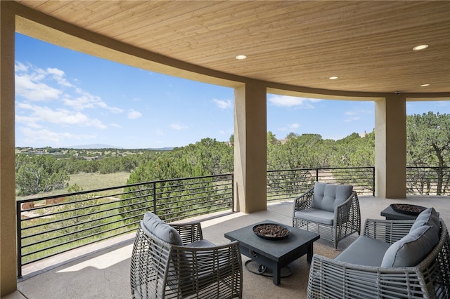 view of patio / terrace with an outdoor living space and a balcony