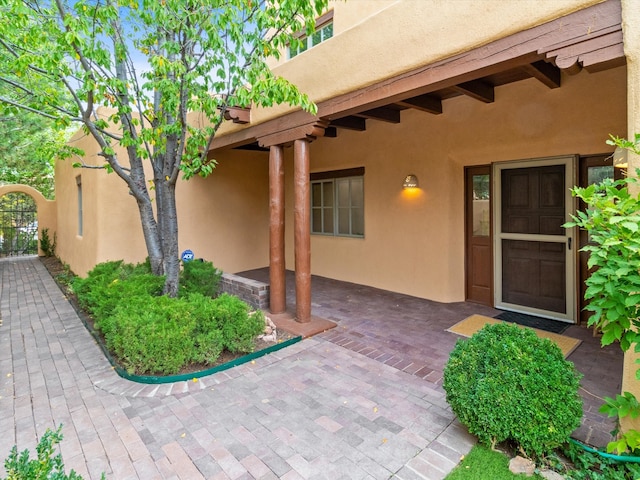 doorway to property featuring a patio