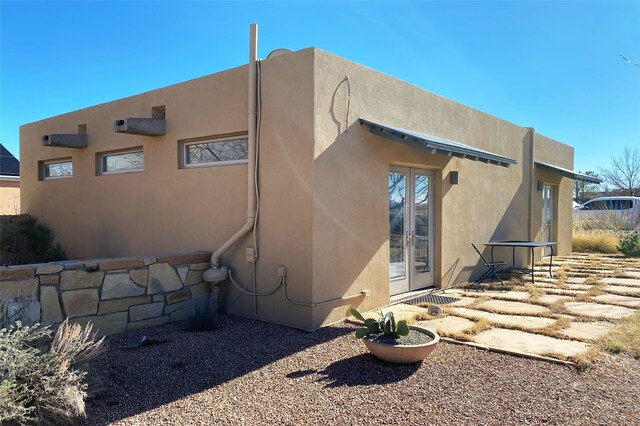 back of house featuring french doors