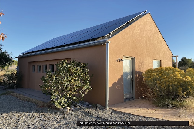 view of home's exterior featuring solar panels