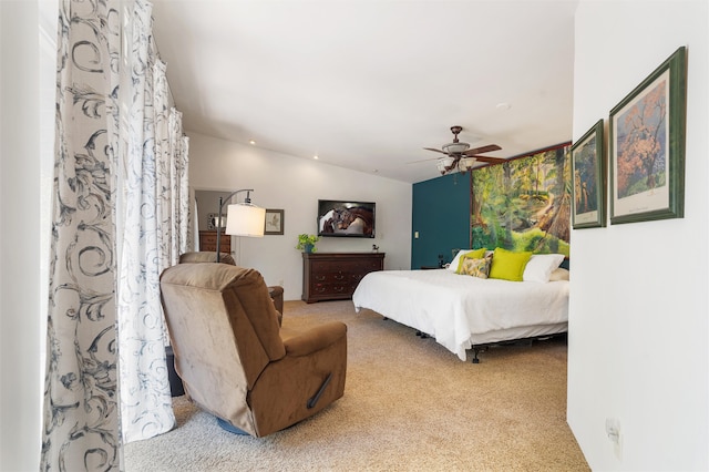 bedroom with light carpet, vaulted ceiling, and ceiling fan