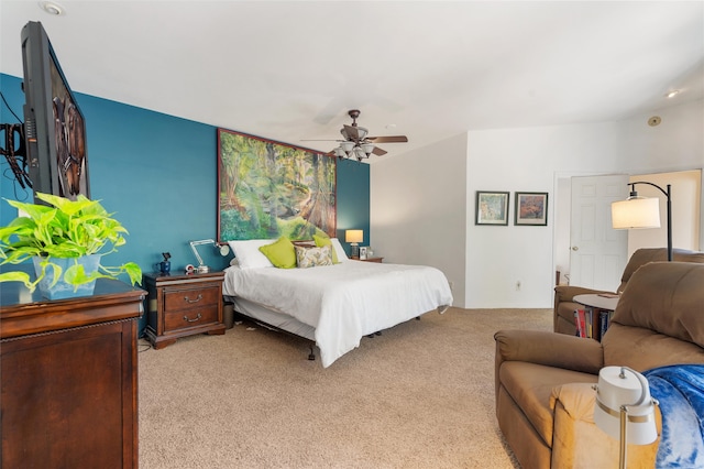 bedroom featuring light colored carpet and ceiling fan