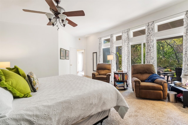 bedroom featuring access to outside, ceiling fan, and carpet