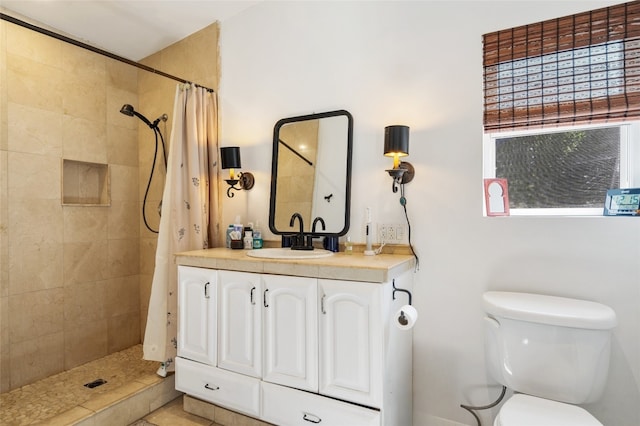 bathroom featuring vanity, toilet, and a shower with shower curtain