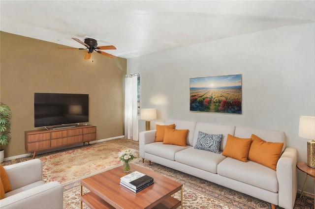 living room featuring ceiling fan and lofted ceiling