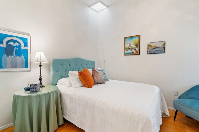 bedroom with wood-type flooring